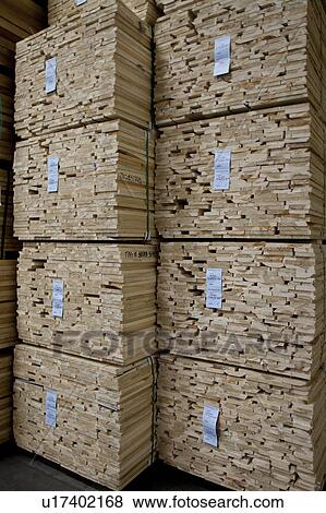 Stock Photo - Close-up of stacks of plywood in warehouse. Fotosearch