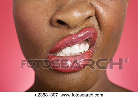 Stock Photo - Close up of woman making a face. Fotosearch