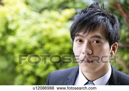 Stock Photo - Close-up portrait of confident businessman. Fotosearch
