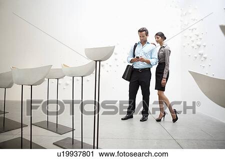Couple with Glazed ceramics boats in art gallery View Large Photo Image Stock Image - Couple with Glazed ceramics boats in art gallery. Fotosearch
