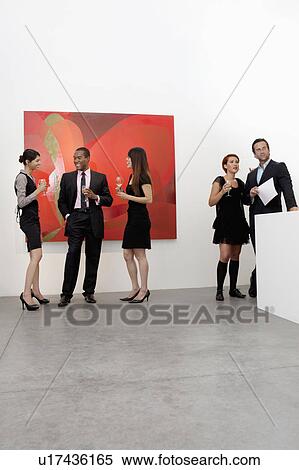 Stock Photography - Group of people in art art gallery. Fotosearch