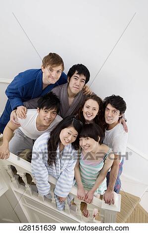 Group portrait of friends on stairway View Large Photo Image Stock Photo - Group portrait of friends on stairway. Fotosearch