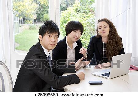 Group portrait of three businesspeople View Large Photo Image Stock Image - Group portrait of three businesspeople. Fotosearch