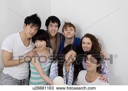 Stock Image - Group portrait of young friends. Fotosearch