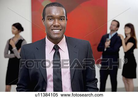 Half-length portrait of young male executive in art gallery View Large Photo Image Stock Photography - Half-length portrait of young male executive in art gallery. Fotosearch