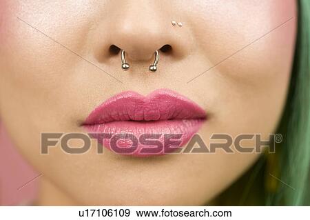 Lips of young woman wearing pink lipstick View Large Photo Image Stock Photo - Lips of young woman wearing pink lipstick. Fotosearch