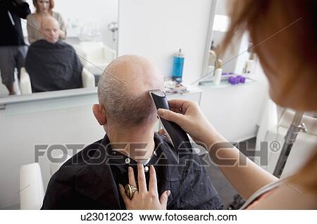 Man getting his head shaved in salon View Large Photo Image Stock Image - Man getting his head shaved in salon. Fotosearch