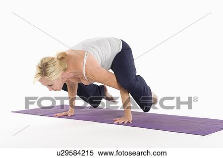 Mature woman balancing on her hands View Large Photo Image Stock Photography - Mature woman balancing on her hands. Fotosearch