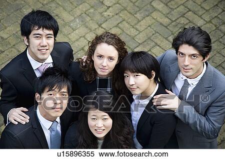 Stock Photography - Multi ethnic business group looking up. Fotosearch