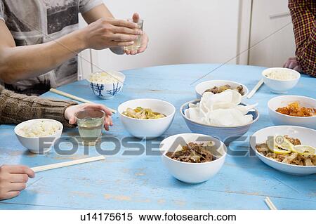 People having breakfast on table together View Large Photo Image Stock Photography - People having breakfast on table together. Fotosearch