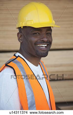 Picture - Portrait of a cheerful warehouse worker. Fotosearch