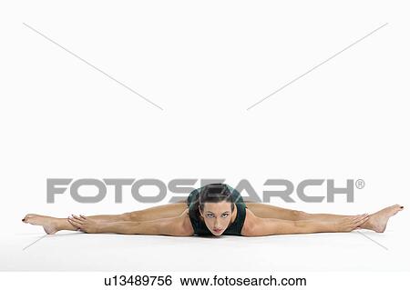 Stock Photograph - Portrait of a mid adult woman exercising. Fotosearch