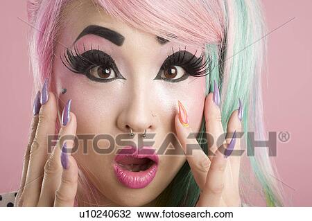 Stock Image - Portrait of a surprised young woman. Fotosearch
