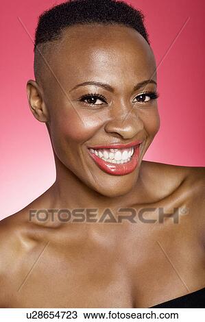 Stock Image - Portrait of cheerful African American woman. Fotosearch