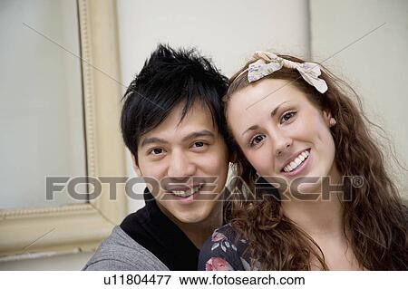 Portrait of happy young couple View Large Photo Image Stock Photo - Portrait of happy young couple. Fotosearch