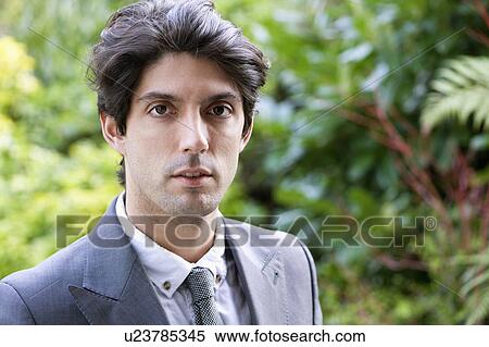 Stock Photography - Portrait of serious businessman. Fotosearch
