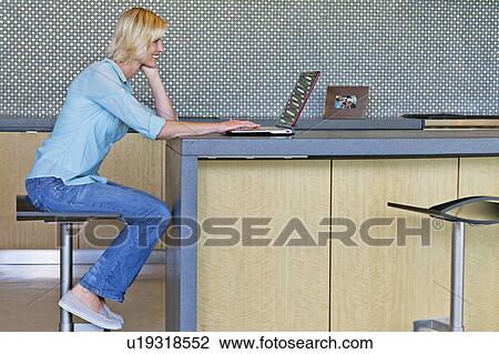 Senior woman using laptop View Large Photo Image Stock Image - Senior woman using laptop. Fotosearch