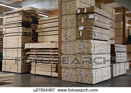Stacks of plywood piled up in warehouse View Large Photo Image Stock Photo - Stacks of plywood piled up in warehouse. Fotosearch