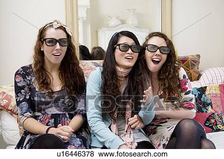 Surprised friends looking at something interesting View Large Photo Image Stock Photo - Surprised friends looking at something interesting. Fotosearch