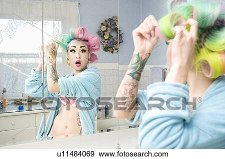 Surprised young woman with hair curlers View Large Photo Image Stock Photo - Surprised young woman with hair curlers. Fotosearch