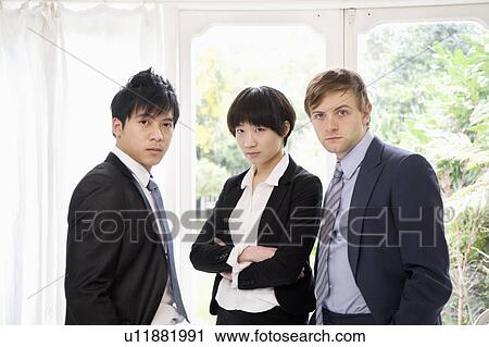 Three confident businesspeople View Large Photo Image Stock Image - Three confident businesspeople. Fotosearch