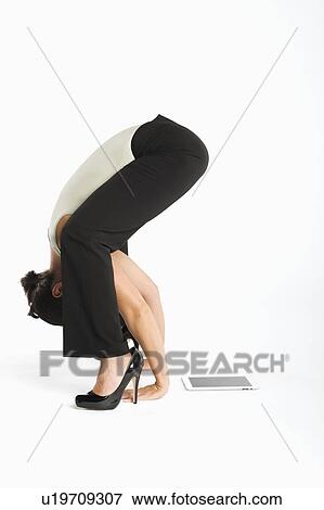 Woman exercising with tablet pc on side View Large Photo Image Stock Photo - Woman exercising with tablet pc on side. Fotosearch