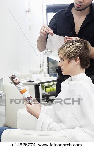Woman having her hair highlighted View Large Photo Image Picture - Woman having her hair highlighted. Fotosearch