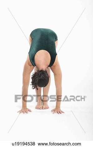 Woman in yoga position View Large Photo Image Stock Photo - Woman in yoga position. Fotosearch