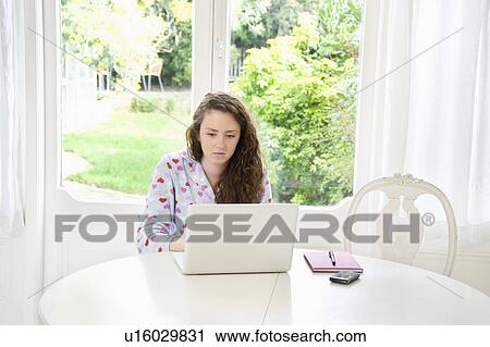 Woman using laptop View Large Photo Image Stock Image - Woman using laptop. Fotosearch
