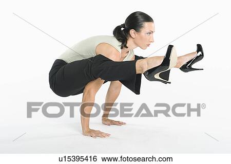 Stock Photograph - Woman with high heels exercising. Fotosearch
