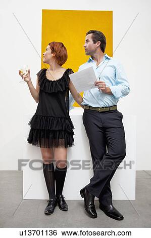 Young couple looking at something interesting with curiosity View Large Photo Image Stock Photograph - Young couple looking at something interesting with curiosity. Fotosearch