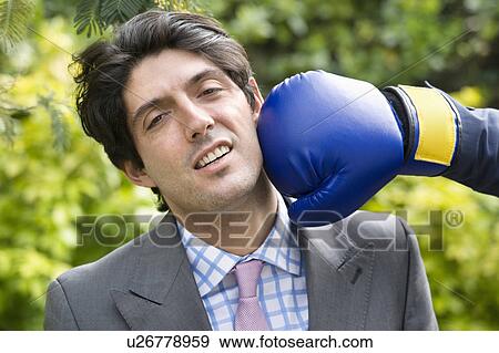 Young man getting hit View Large Photo Image Stock Photo - Young man getting hit. Fotosearch
