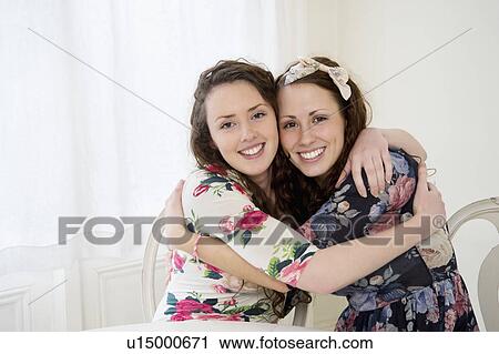Stock Image - Young siblings hugging. Fotosearch