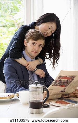 Young woman hugging man View Large Photo Image Stock Photo - Young woman hugging man. Fotosearch