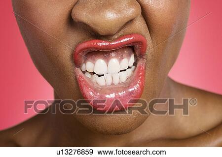 Stock Photo - Young woman making face. Fotosearch