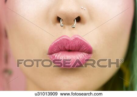 Young woman puckering her lips View Large Photo Image Stock Photo - Young woman puckering her lips. Fotosearch