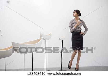 Young woman standing with Glazed ceramics boats View Large Photo Image Stock Image - Young woman standing with Glazed ceramics boats. Fotosearch