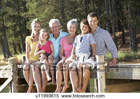 3 Generation family sitting by lake View Large Photo Image Stock Photography - 3 Generation family sitting by lake. Fotosearch