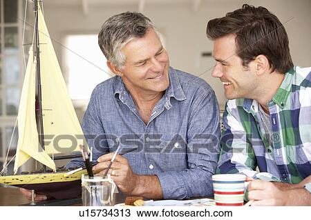 Adult father and son model making View Large Photo Image Stock Image - Adult father and son model making. Fotosearch
