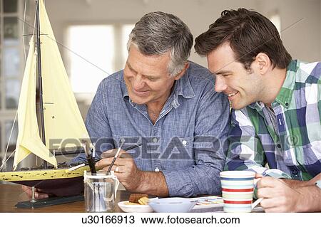 Adult father and son model making View Large Photo Image Stock Image - Adult father and son model making. Fotosearch