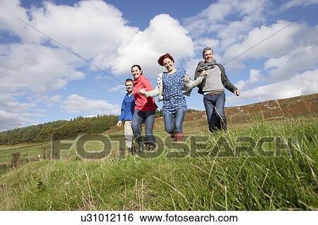 Stock Photograph - Adult group in countryside. Fotosearch