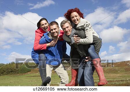 Stock Photography - Adult group in countryside. Fotosearch