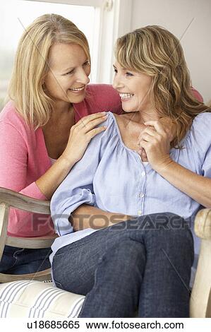 Adult mother and daughter at home View Large Photo Image Stock Photography - Adult mother and daughter at home. Fotosearch