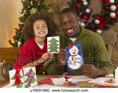 African American father and mixed race son making Christmas cards View Large Photo Image Stock Image - African American father and mixed race son making Christmas cards. Fotosearch