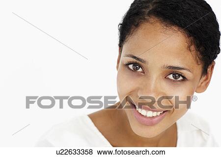 Attractive young woman smiling View Large Photo Image Stock Photo - Attractive young woman smiling. Fotosearch