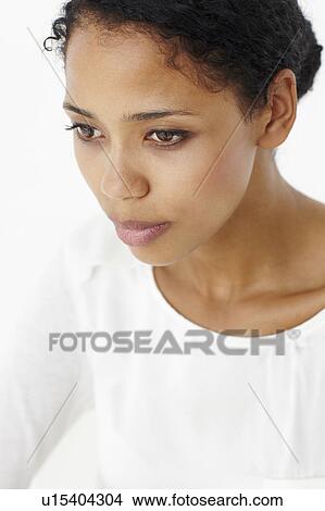 Picture - Attractive young woman thinking. Fotosearch