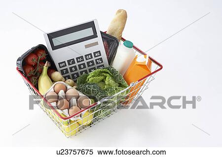 Basket of groceries and calculator View Large Photo Image Stock Photography - Basket of groceries and calculator. Fotosearch