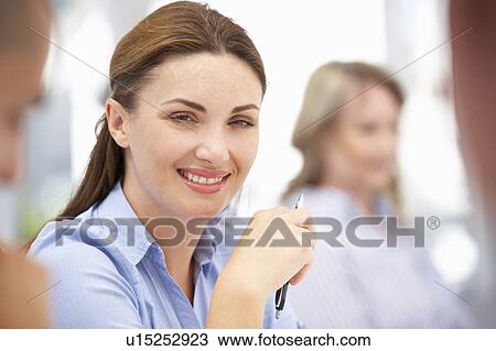 Business colleagues in meeting View Large Photo Image Stock Image - Business colleagues in meeting. Fotosearch