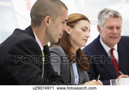 Business colleagues in meeting View Large Photo Image Stock Image - Business colleagues in meeting. Fotosearch