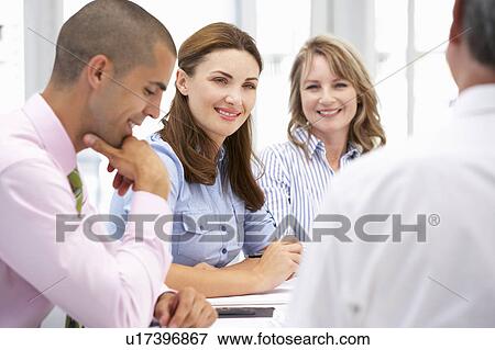 Business colleagues in meeting View Large Photo Image Stock Photo - Business colleagues in meeting. Fotosearch